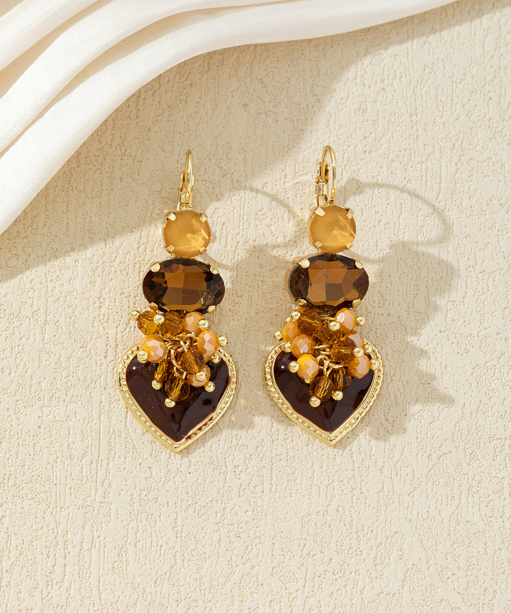 Boucles d’oreilles pendantes avec cœur et perles 27AHBOL001