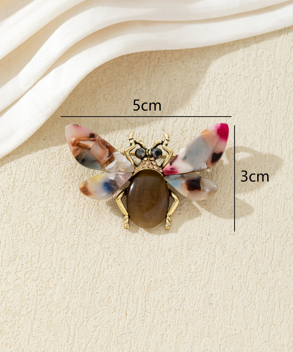 Broche abeille colorée avec ailes effet marbré