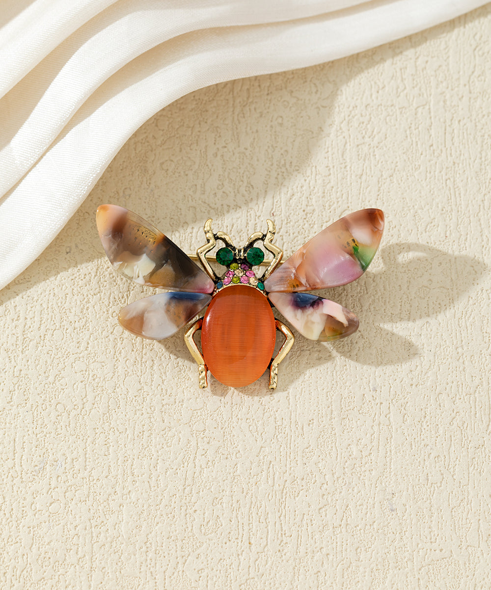 Broche abeille colorée avec ailes effet marbré