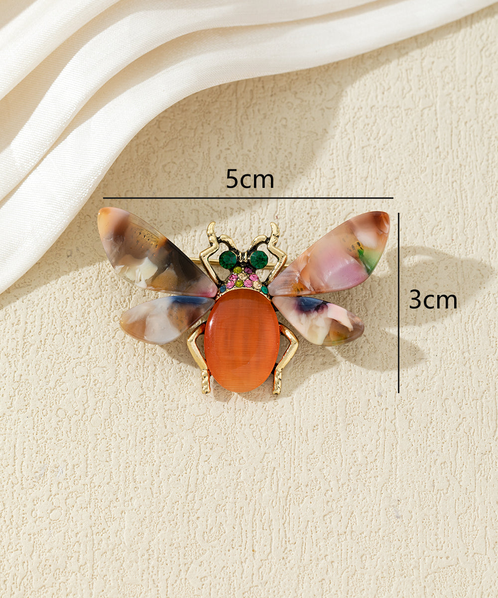 Broche abeille colorée avec ailes effet marbré