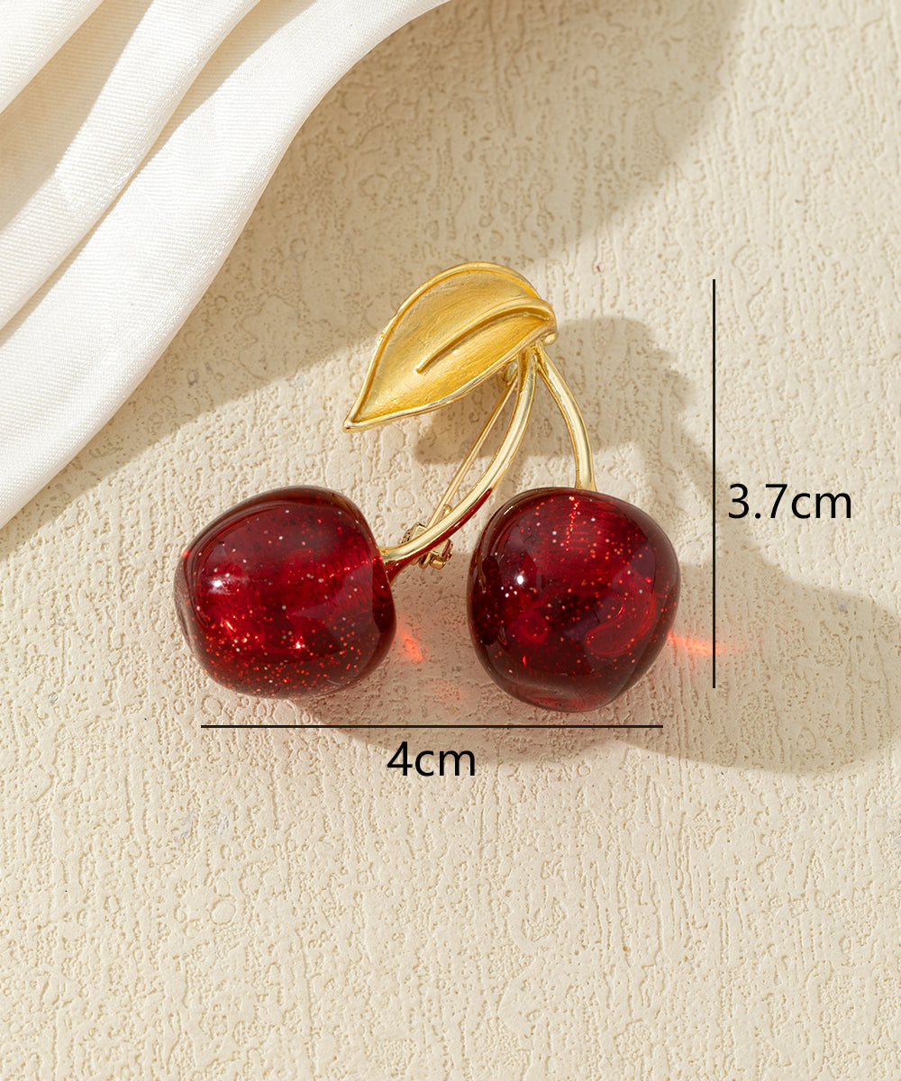 Broche cerises colorées