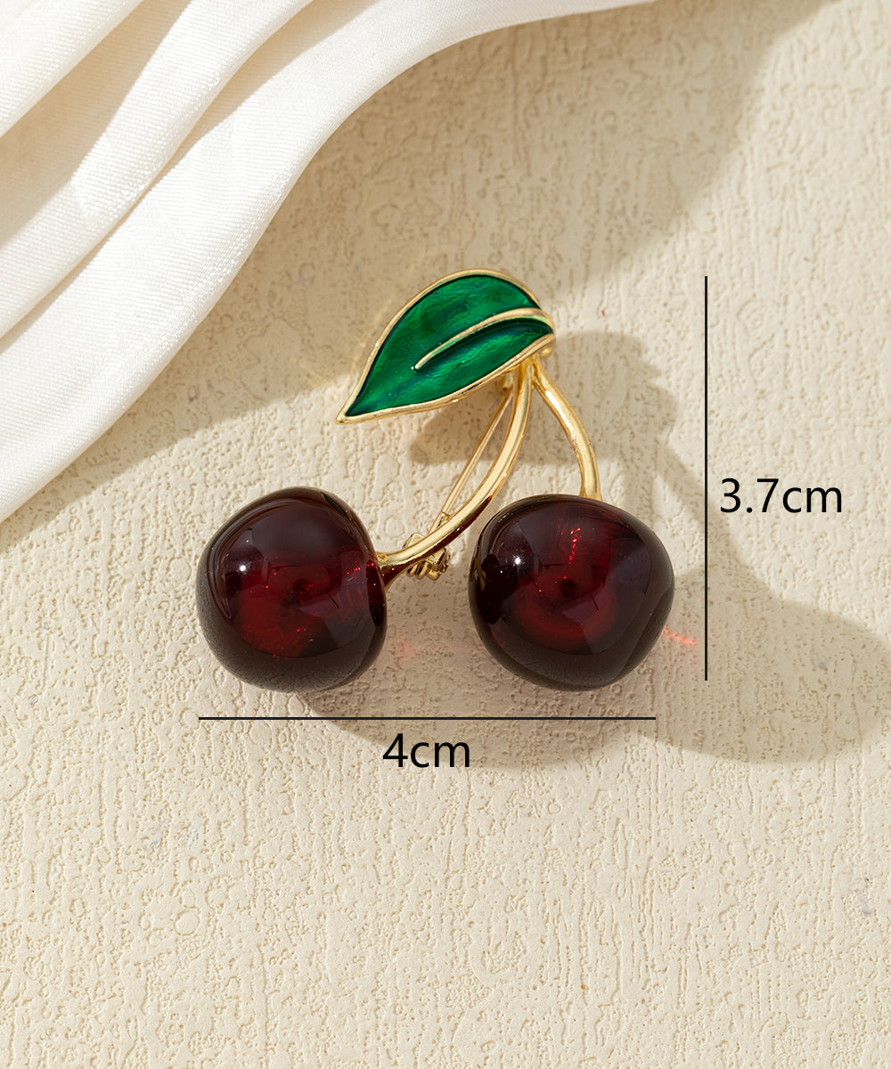 Broche cerises colorées