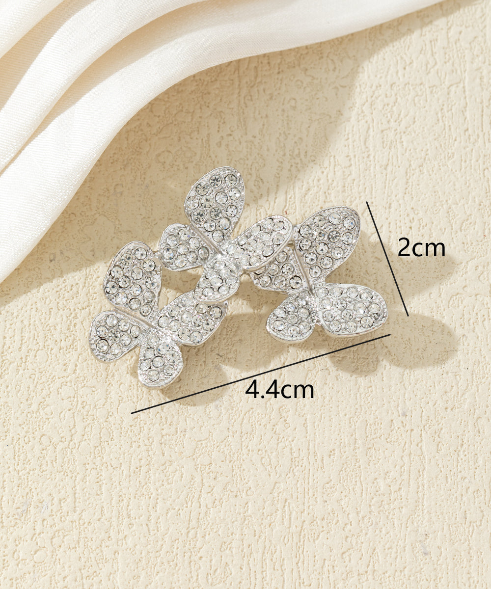 Broche branche fleurie ornée de strass