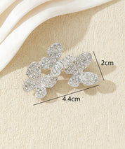 Broche branche fleurie ornée de strass