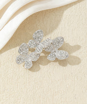 Broche branche fleurie ornée de strass