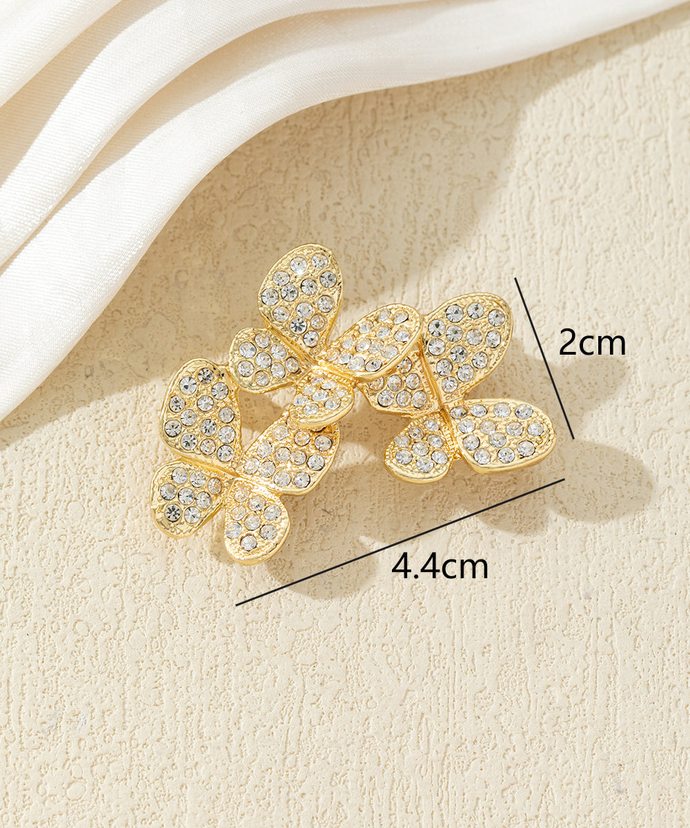 Broche branche fleurie ornée de strass