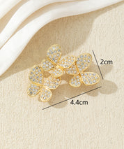 Broche branche fleurie ornée de strass