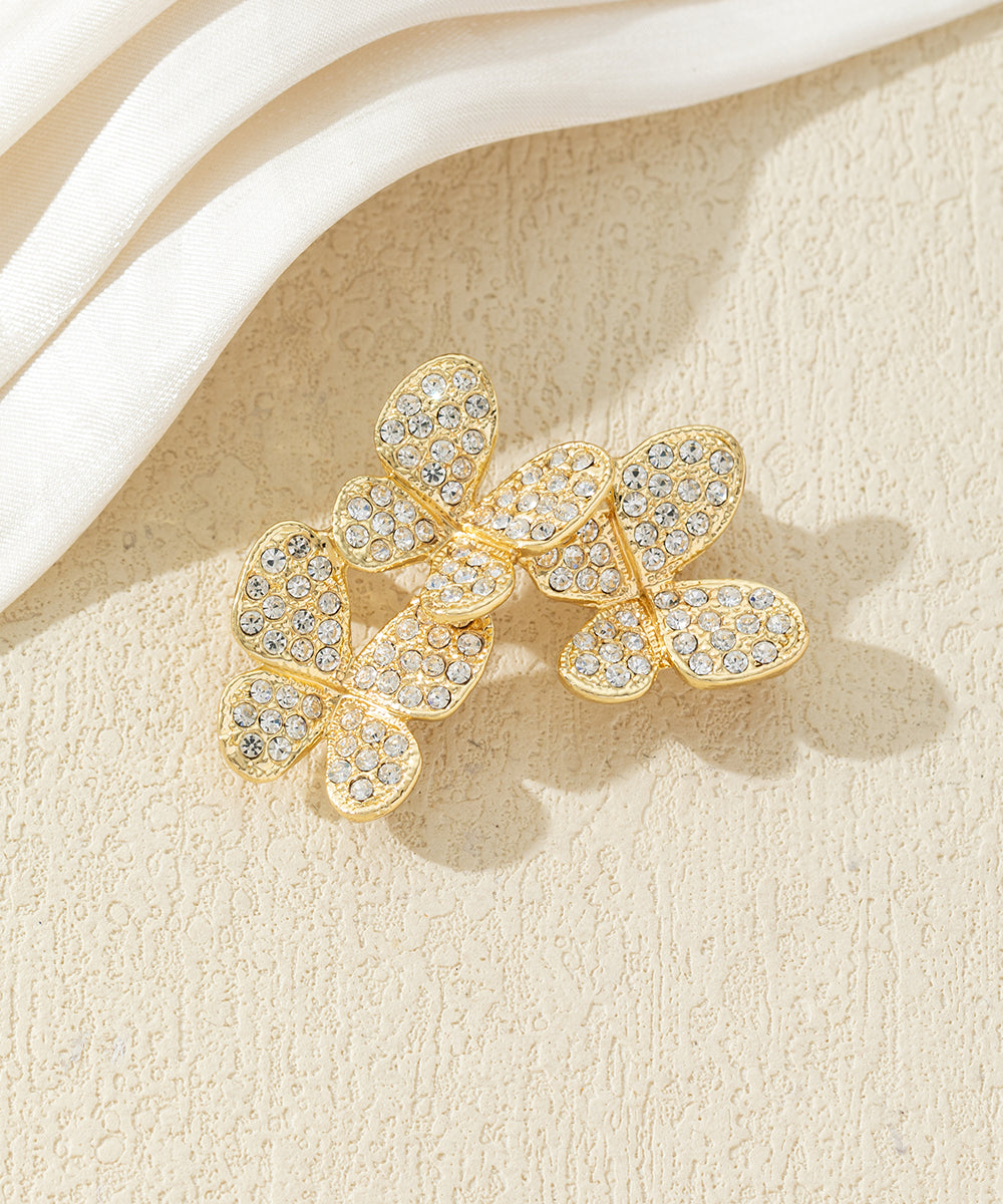 Broche branche fleurie ornée de strass
