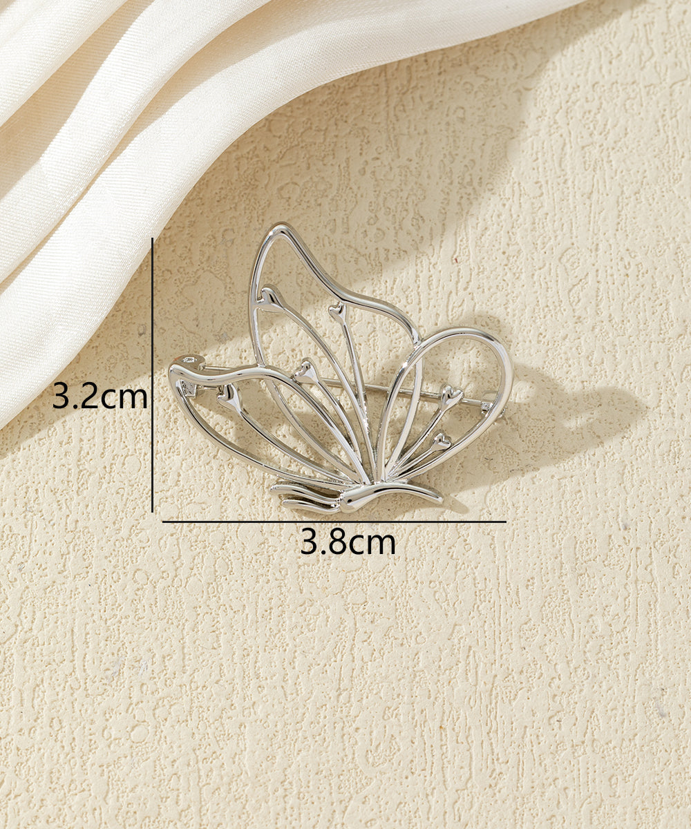 Broche papillon ajourée dorée ou argentée
