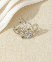 Broche papillon ajourée dorée ou argentée