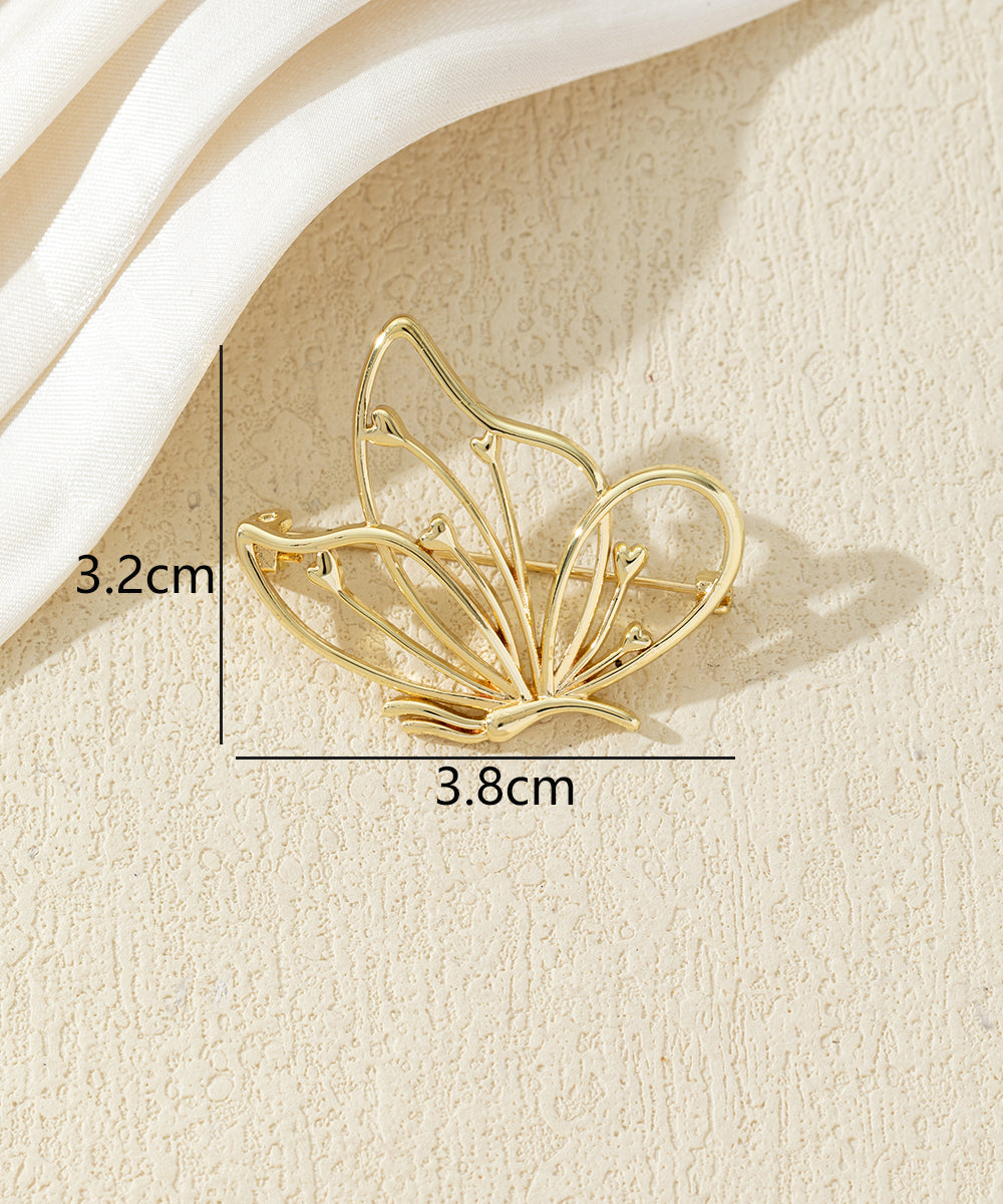 Broche papillon ajourée dorée ou argentée