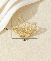 Broche papillon ajourée dorée ou argentée