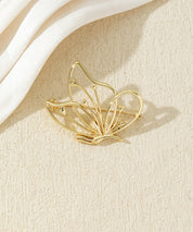 Broche papillon ajourée dorée ou argentée