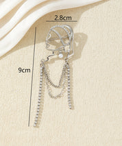 Broche visage féminin avec chaînes strass