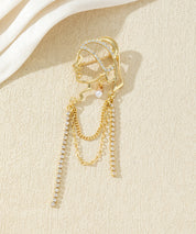 Broche visage féminin avec chaînes strass
