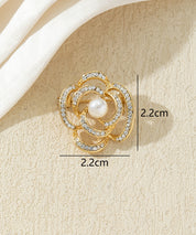 Broche fleur dorée avec perle et strass